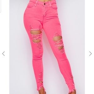 Neon pink distressed jeans